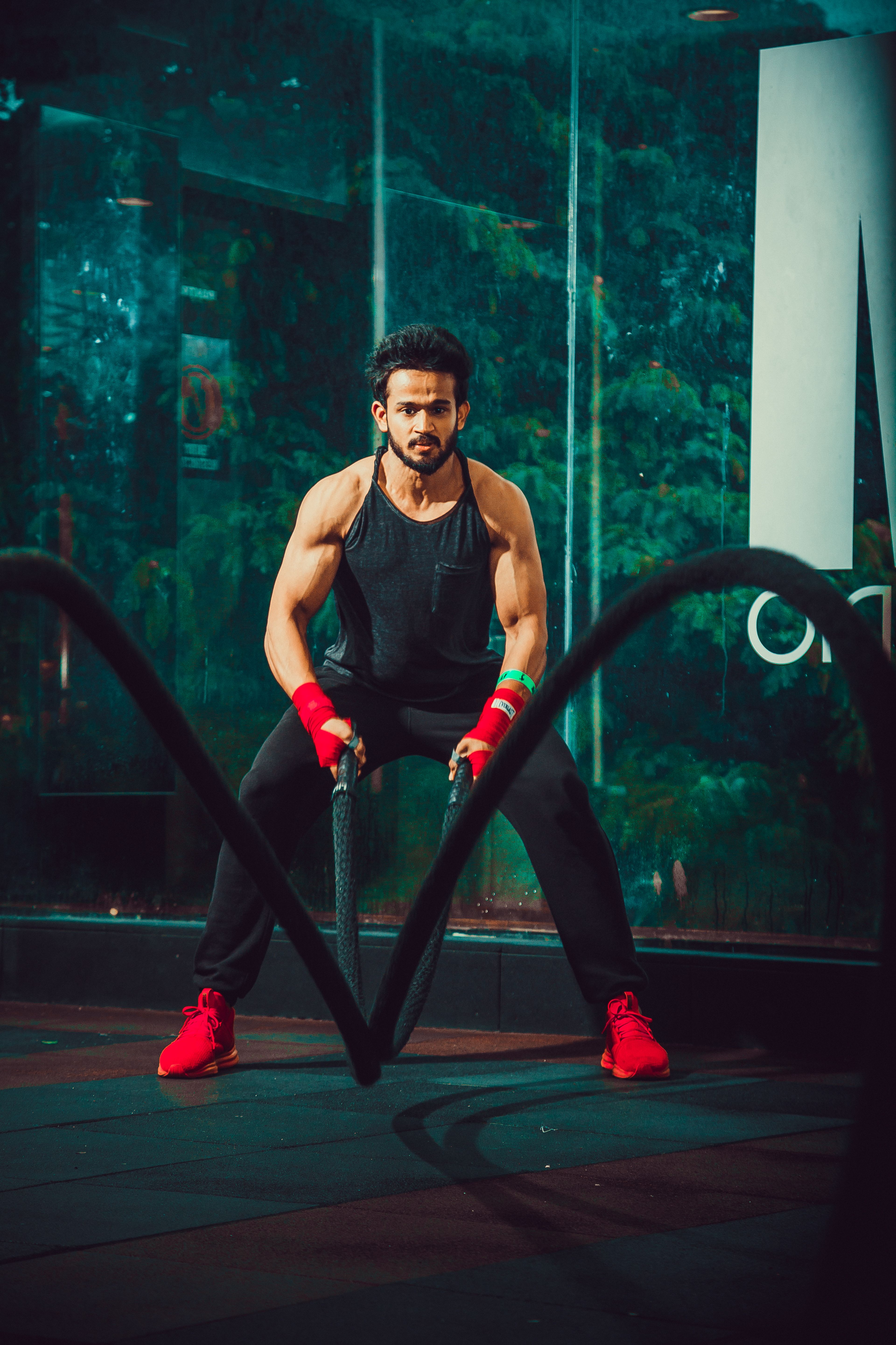 Athlete training with battle ropes
